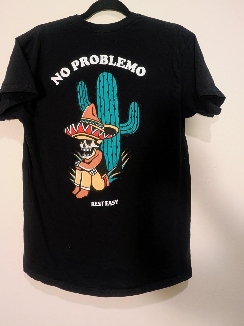 Rest Easy black cotton t-shirt with "No Problemo" graphic